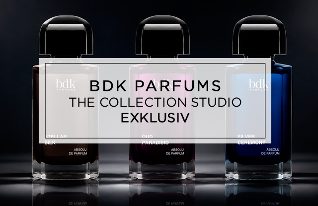 Drei elegante Parfumflakons von BDK Parfums stehen nebeneinander vor dunklem Hintergrund, stilvoll ausgeleuchtet mit Spiegelungen und dem Logo links daneben.