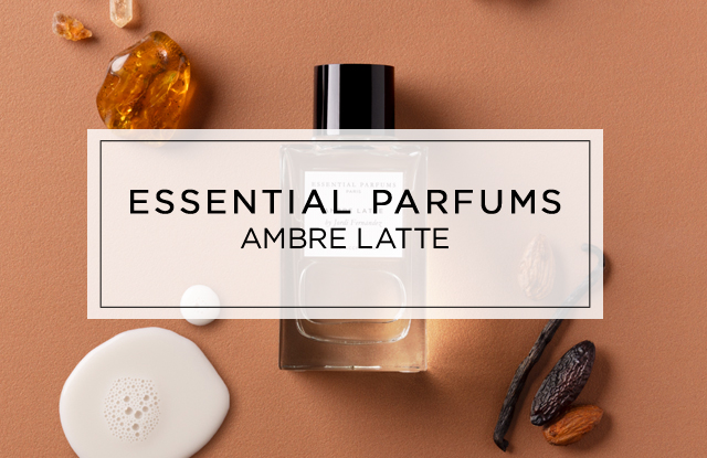 Bannerbild für das Parfum „Ambre Latte“ von Essential Parfums mit zwei Flakons, umgeben von bernsteinfarbenen Kristallen, Vanilleschoten und warmen Brauntönen.