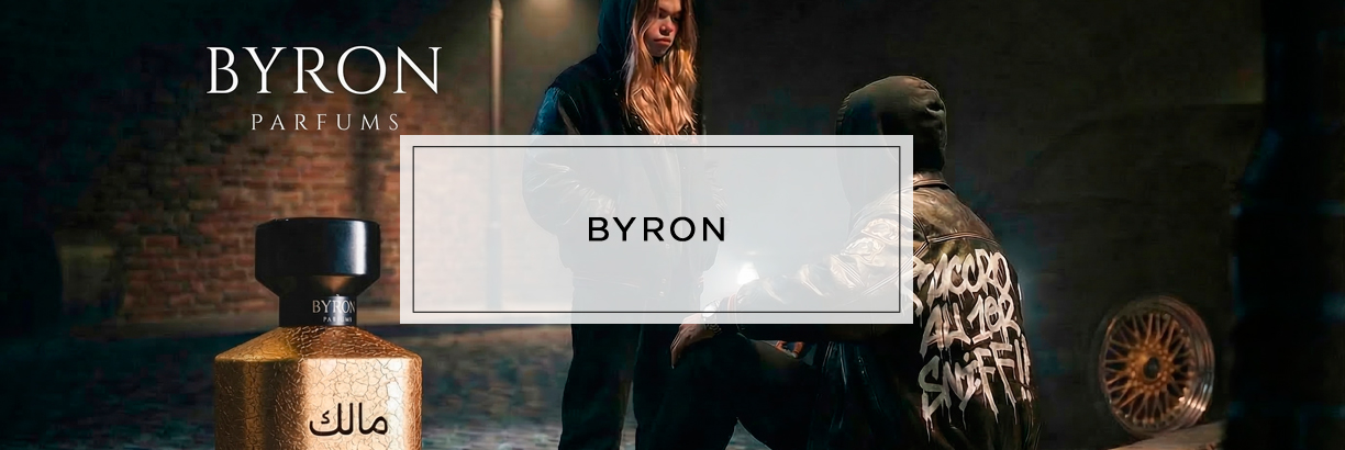 BYRON Parfums mit einem goldenen Parfümflakon im Vordergrund und zwei dunkel gekleideten Personen in einer urbanen, stimmungsvoll beleuchteten Szene im Hintergrund.