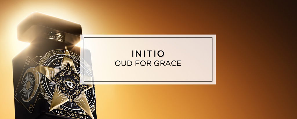 Parfum ‚Initio Oud for Greatness‘ mit schwarzem, goldverziertem Flakon vor warm leuchtendem, goldbraunem Hintergrund.