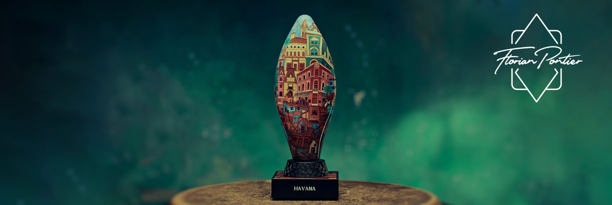 Havanna-Duft von Florian Portier – kunstvoll gestalteter, ovaler Flakon mit farbenfroher Stadtillustration auf schwarzem Sockel mit der Aufschrift „HAVANA“ vor grünem Hintergrund.