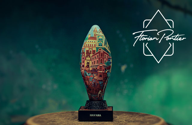 Havanna-Duft von Florian Portier – kunstvoll gestalteter, ovaler Flakon mit farbenfroher Stadtillustration auf schwarzem Sockel mit der Aufschrift „HAVANA“ vor grünem Hintergrund.