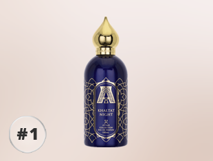 Parfumflakon Attar Collection Khaltat Night in Dunkelblau mit goldener Verzierung und goldfarbenem Verschluss