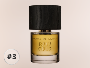Parfumflakon Raw Gold von Thomas de Monaco mit goldfarbenem Duftöl und dunklem Holzverschluss