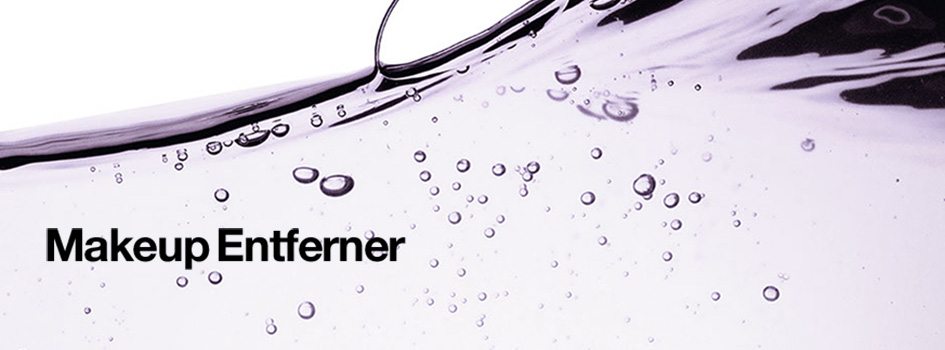 Text 'Makeup Entferner' auf einem flüssigen, lila-transparenten Hintergrund mit Luftblasen, der an eine Reinigungslotion oder Mizellenwasser erinnert.