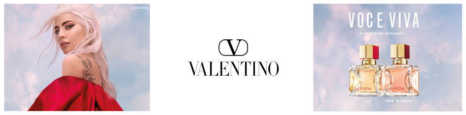 Werbeanzeige für Valentino-Parfüm 'Voce Viva'. Links posiert Sängerin Lady Gaga mit platinblondem Haar, rotem Umhang und sichtbarem Tattoo auf der Schulter vor einem Himmel mit rosa-blauen Wolken. In der Mitte das Valentino-Logo. Rechts zwei Parfümflakons mit gold-rotem Verschluss und dem Schriftzug 'Valentino'. Text oben: 'Voce Viva – My Voice, My Strength'. Unten: 'New Intensa'.